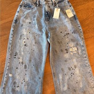 Good American Light Blue Jeans with paint splatter